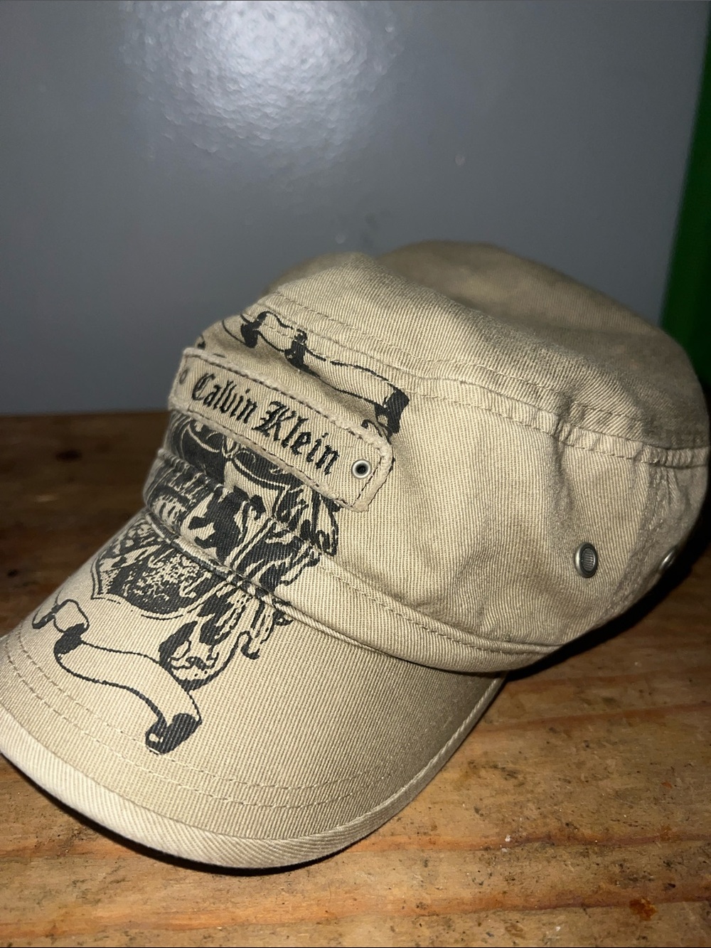 Calvin Klein Beige Military-Style Cap with Black Graphic